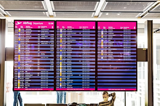 Berlin, Germany - February 7, 2022: departure board with actual information about gate and departing flight.