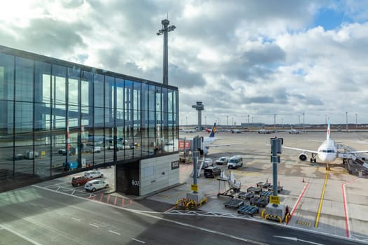 Berlin, Germany - February 7, 2022: airfield and view to Ryanair aircraft  at Willy Brandt airport in Berlin.