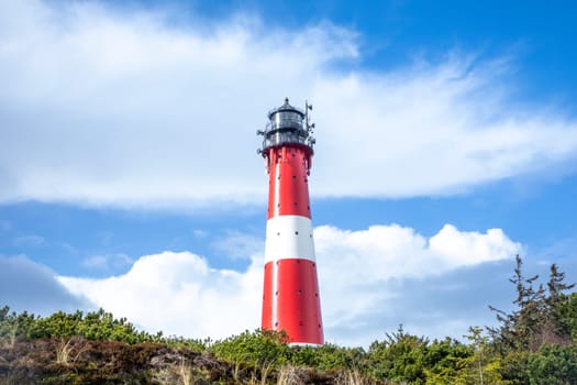 Hoernum, Germany - February 19, 2022: lighthouse of Hoernum on Sylt island, Germany. Landmark, tourist attraction and guiding light for navigation on the North Sea.