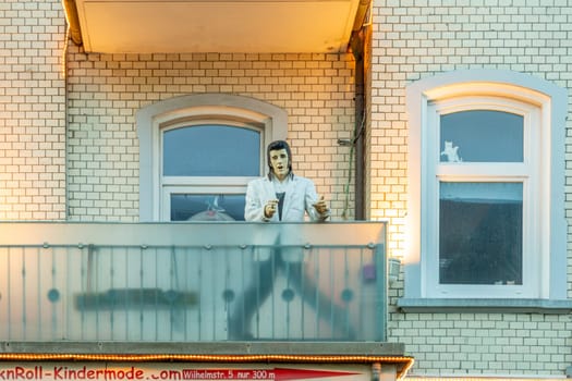 Westerland, Germany - February 19, 2022: singer Elvis Presley as puppet on a balcony in Westerland, Sylt Island, Schleswig-Holstein, Germany.
