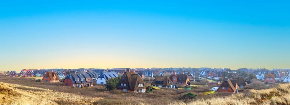 Wenningstedt, Germany - February 16, 2022: typical reed roofed house in Wenningstedt at the Island of Sylt.