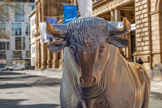 Frankfurt, Germany - April 11, 2022: Bear and Bull sculpture. Frankfurt Stock Exchange building.