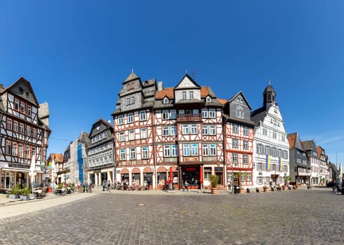 Butzbach, Germany - April 18, 2022: people at the market square in the old town of butzbach germany