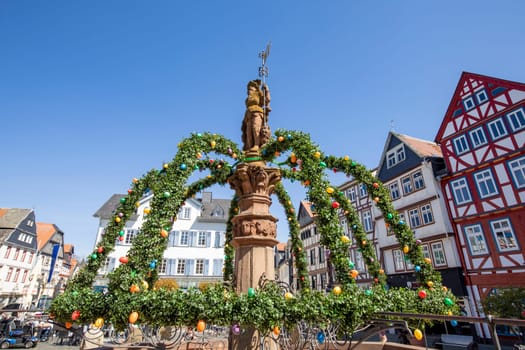 Butzbach, Germany - April 18, 2022: people at the market square in the old town of butzbach germany