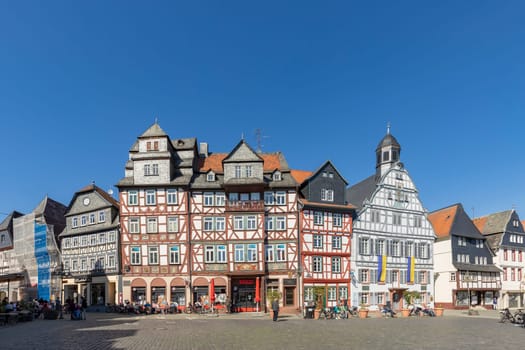 Butzbach, Germany - April 18, 2022: people at the market square in the old town of butzbach germany