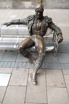 Vitoria, Spain - April 24, 2022: Bench statue sculpture of Michael C. Williams, Victoria, British Columbia, Canada.