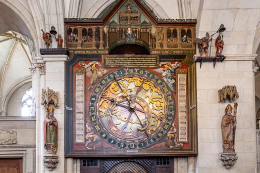 Muenster, Germany - April 29, 2022: The astronomical clock in the St.Paulus Cathedral in Münster which was built in the Middle Ages and from which you can read the time.
