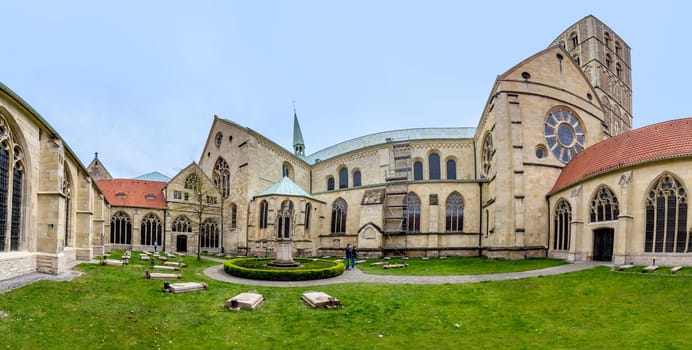 Münster, Germany - April 29, 2022: cemetery of the catholic cathedral in Muenster with graves of priests,bishop and other clerical people.