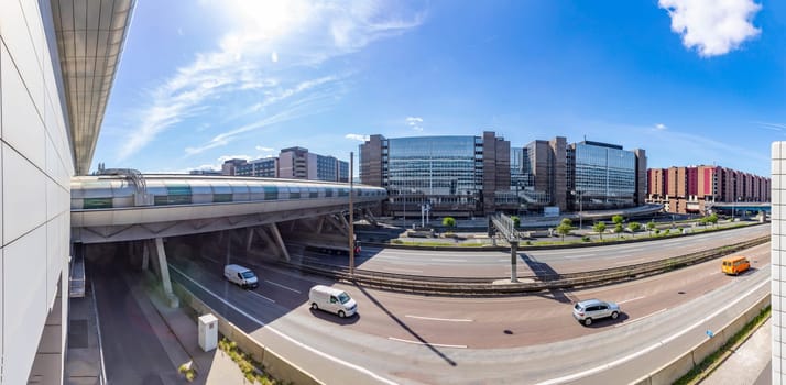 Frankfurt, Germany - May 13, 2022: panoramic view to Terminal 1 at Frankfurt international airport with highway passing and office buildings.