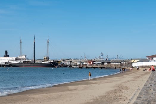San Francisco, USA - May 18, 2022: Hyde Street Pier in Fisherman's Wharf. Historical ships are anchored to the pier available for tours as part of the San Francisco Maritime National Historical Park.