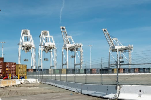 Oakland,USA - May 18, 2022: harbor cranes to carry containers at Oakland harbor, San Francisco, USA