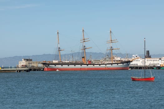 San Francisco, USA - May 18, 2022: panoramic view to Hyde pier in San Francisco with historic sailor Balclutha and other ships.