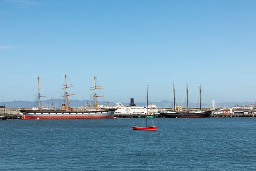 San Francisco, USA - May 18, 2022: view to fishermans wharf area in San Francisco with skyline and old traditional boats at Hyde street pier.