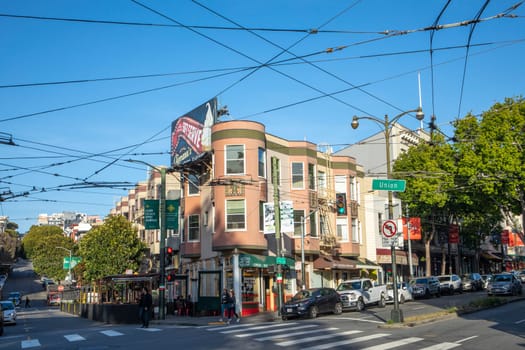 San Francisco, USA - May 18, 2022:  old houses in downtown San Francisco in bright light at Union street.