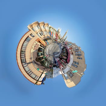 San Francisco, USA - May 18, 2022:  old houses in downtown San Francisco in bright light with view to transamerica pyramid in little planet styleat columbus square and Stockton street.