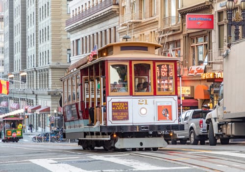 San Francisco, USA - May 18, 2022: historic  Cable Car Powell Hyde Line on turntable at Powell Street terminal at Market Street in downtown San Francisco, California CA, USA.