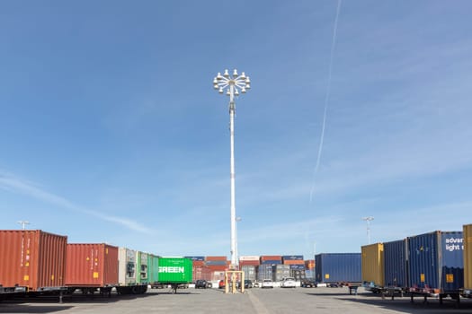 Oakland, USA - May 18, 2022: container at Oakland harbor in panoramic view. Oakland harbor serves San Francisco with goods.