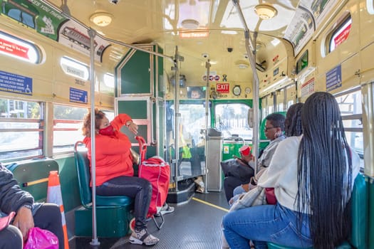 San Francisco, USA - May 20, 2022:  people in the old classic streetcar bus in vintage style downtown San Francisco
