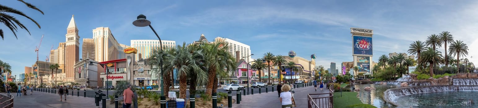 Las Vegas, USA - May 23, 2022: vview of the Venetian Hotel and casino with palm trees in front and panoramic view of the strip.