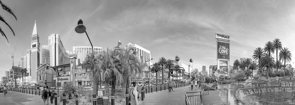 Las Vegas, USA - May 23, 2022: panoramic view of the Venetian Hotel and other famous hotels and casino with palm trees in front at the strip.