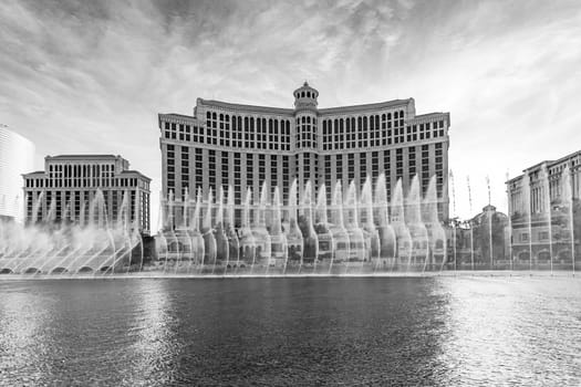 Las Vegas, Nevada, USA - June 26, 2022: The Fountains of Bellagio at night. This feature performs choreography with water, music and light in front of the Bellagio hotel and casino.
