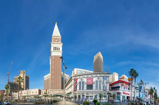 Las Vegas, USA - May 23, 2022: view of the Venetian Hotel and casino with palm trees in front.