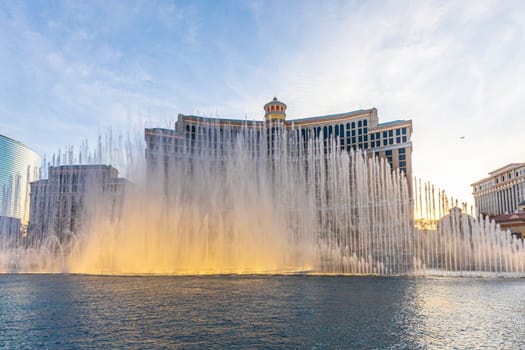 Las Vegas, Nevada, USA - June 26, 2022 : The Fountains of Bellagio at night. This feature performs choreography with water, music and light in front of the Bellagio hotel and casino.