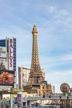 Las Vegas, USA - May 23, 2022:  Eiffel Tower and city hotels along The Strip on a sunny day.