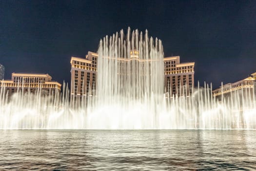 Las Vegas, Nevada, USA -May 23, 2022 : The Fountains of Bellagio at night. This feature performs choreography with water, music and light in front of the Bellagio hotel and casino.