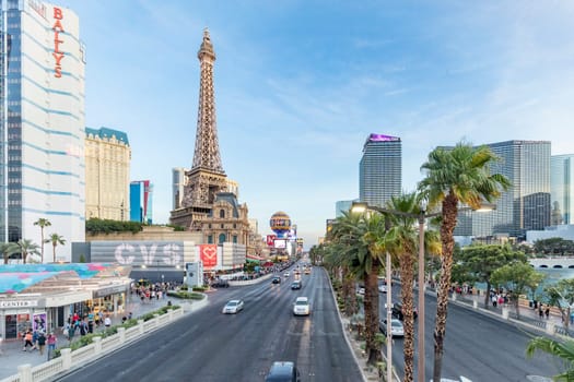 Las Vegas, USA - May 23, 2022: panoramic view of the Ballys Hotel and other famous hotels and casino with palm trees and Eiffel tower at the strip.