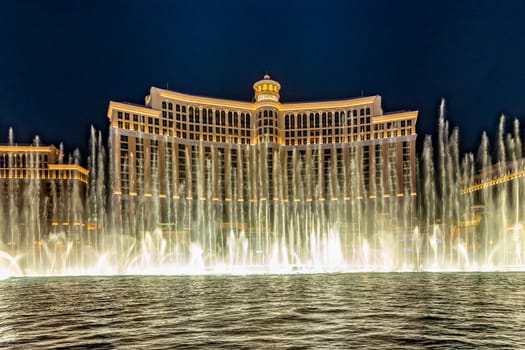 Las Vegas, Nevada, USA -May 23, 2022 : The Fountains of Bellagio at night. This feature performs choreography with water, music and light in front of the Bellagio hotel and casino.