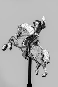 Las Vegas, USA - May 24, 2022: The Old Hacienda Horse neon sign high above the Fremont Street Experience, a popular, busy area downtown Las Vegas that offers many historical attractions.
