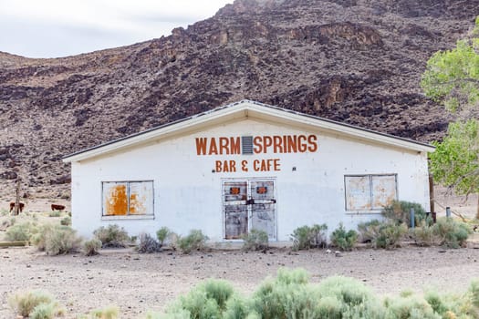Warm Springs, USA - June 2, 2022: old rotten closed and abandoned Bar and Cafe at Route 375, the extraterrestrial Highway in the former desert village Warm Springs.