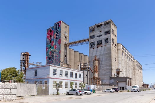 San Francisco, USA - June 6, 2022: old abandoned rotten concrete factory at the pier downtown in San Francisco, USA.
