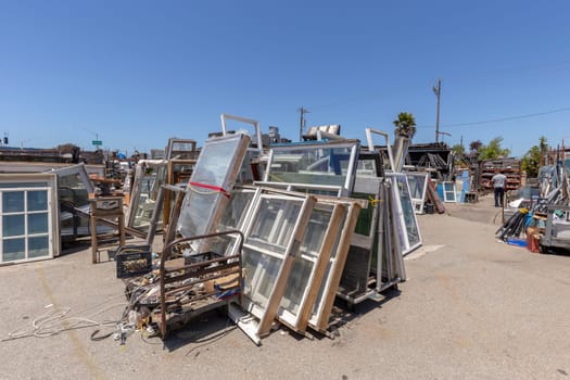 San Francisco, USA - June 6, 2022: junkyard in San Francisco with used window frames objekts.