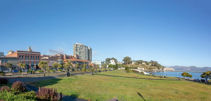 San Francisco, USA - June 6, 2022: view to Ghirardelli chocolate factory from Mareitime Garden with public park and recreation area.