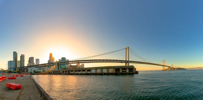 San Francisco, USA - June 6, 2022: view to Bay bridge in San Francisco in sunset  mood with skyline.