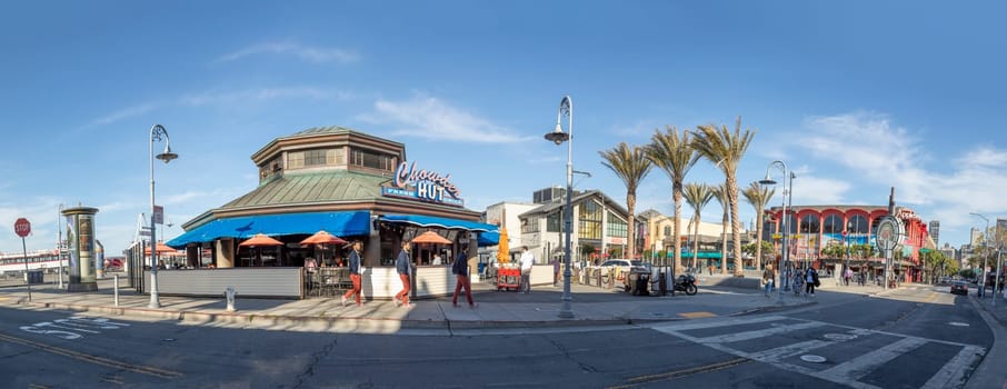 San Francisco, USA - June 7, 2022:  people enjoy eating and looking at fishermans wharf in San Francisco on a sunny afternoon.