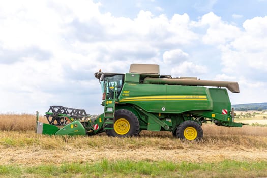 Luhr, Germany - July 9, 2022: Harvester John Deere Hillmaster at the field in operation.