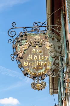 Hattenheim, Germany - July 23, 2022: signage die Adler Wirtschaft - engl: the eagle restaurant - with owner Franz Keller in Hattenheim, Germany.