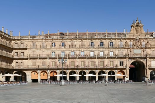 Salamanca, Spain - July 31, 2022: View at the baroque public plaza, 18th century, Plaza Mayor in Salamanca downtown city, Spain