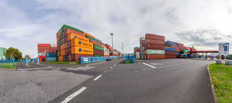 Mainz, Germany - September 29,2022: stapled container in Mainz harbor in different colors.