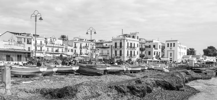 Modello, Italy - February 11, 2023: fishermens boats at the beach  in the center of Mondello.