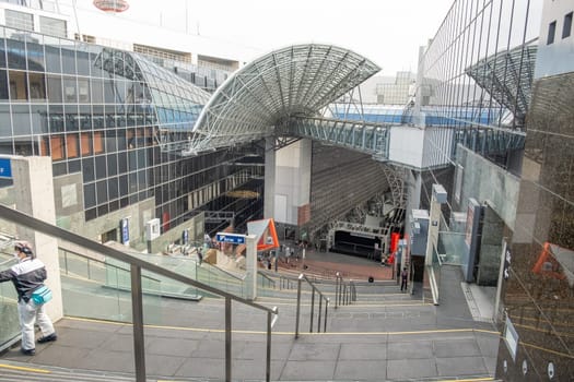 Kyoto, Japan - March 25, 2023: View of Kyoto railway station from the Grand Stairway or Daikaidan. Kyoto. Japan