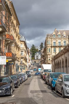 Wiesbaden, Germany - March 26, 2023: view to historic Saalgasse - engl hall street in Wiesbaden. The houses are all built in the 19th century in Wilhelminian style  and well restored.