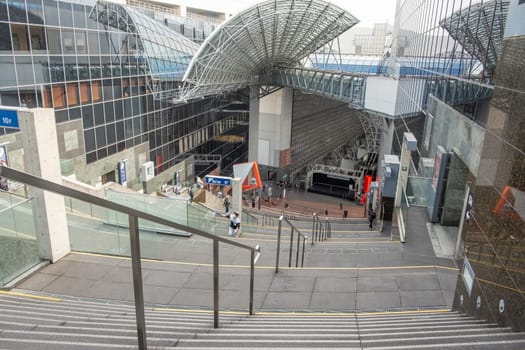 Kyoto, Japan - March 25, 2023: View of Kyoto railway station from the Grand Stairway or Daikaidan. Kyoto. Japan