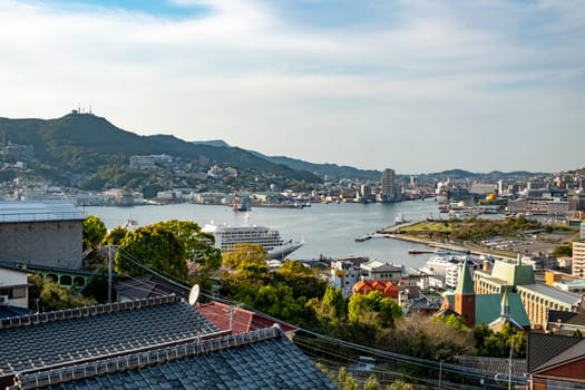 Nagasaki, Japan - April 1, 2023: view to skyline of Nagasaki with harbor seen from Glover garden