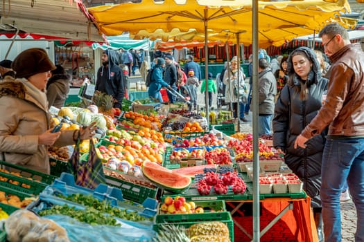 Wiesbaden, Germany - February 25, 2023: farmers sell fresh vegetables and fruits at the farmers market in Wiesbaden to local people.