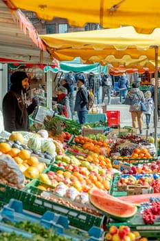 Wiesbaden, Germany - February 25, 2023: farmers sell fresh vegetables and fruits at the farmers market in Wiesbaden to local people.