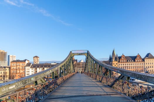 Frankfurt, Germany - February 28, 2023: view to skyline of Frankfurt from pedestrian bridge Eiserner Steg - engl:  iron Bridge, Germany